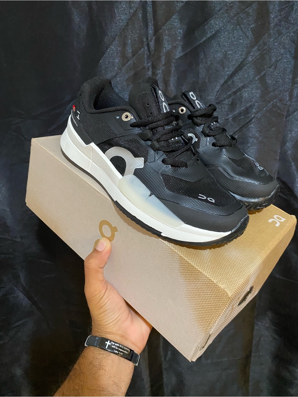 On  the Roger pro2
 Black & White woman’s Athletic Runners